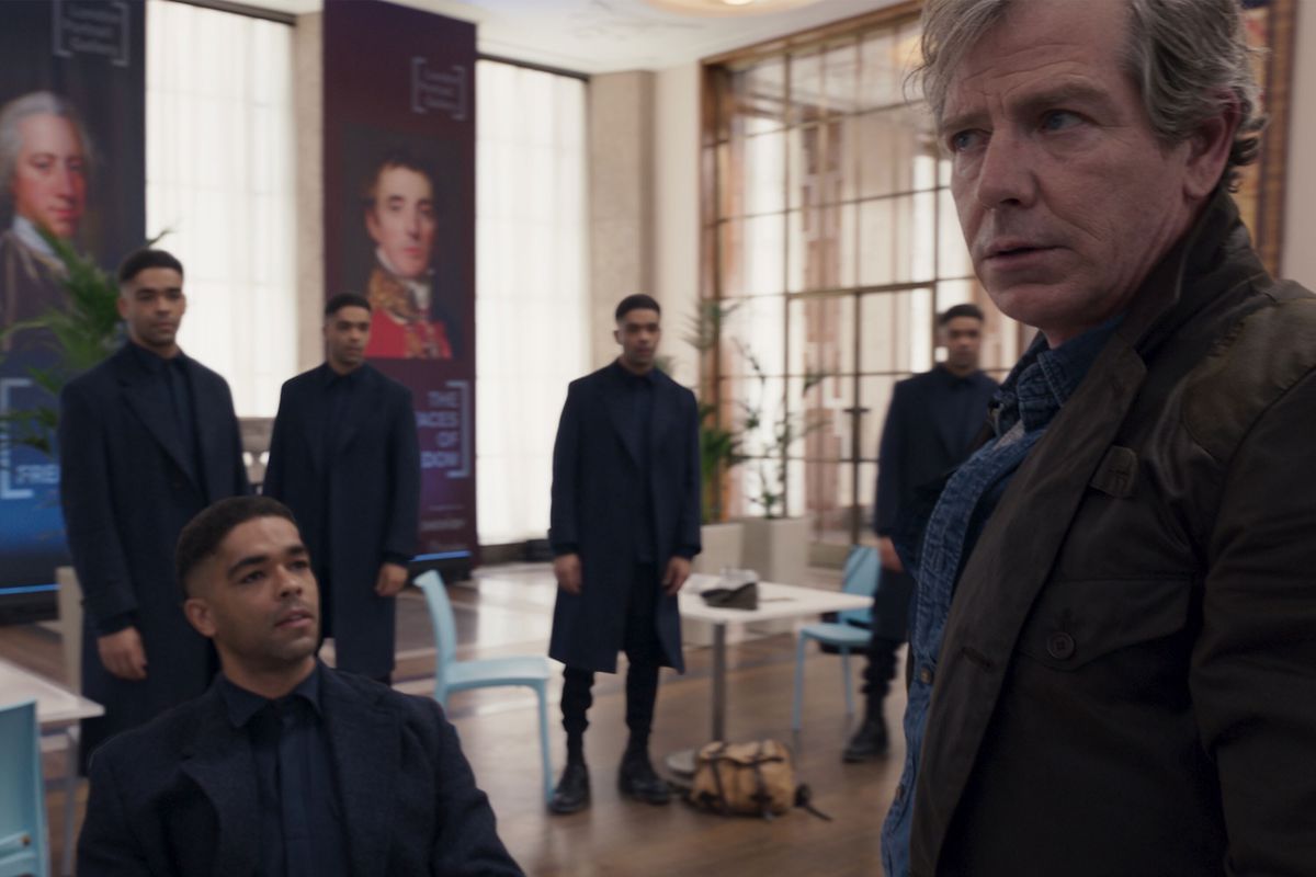 Surrounded by other Skrulls, Gravik (Kingsley Ben-Adir) and Talos (Ben Mendelsohn) converse during 'Secret Invasion' episode 3 | Agents of Fandom