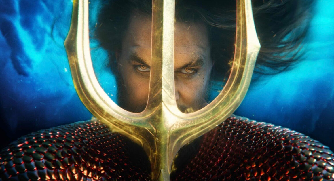 Jason Mamoa as Aquaman holding his trident underwater in Aquaman and The Lost Kingdom | Aquaman and The Lost Kingdom review | Agents of Fandom
