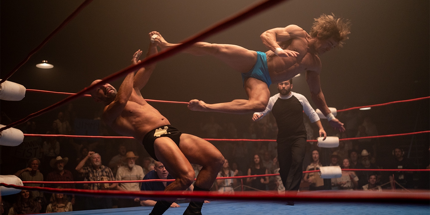 Zac Efron sideways kicking his opponent in the air in The Iron Claw | Agents of Fandom