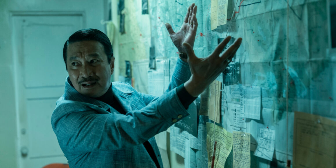The General with his hands out toward a wall of maps and information in the Sympathizer | Agents of Fanodm