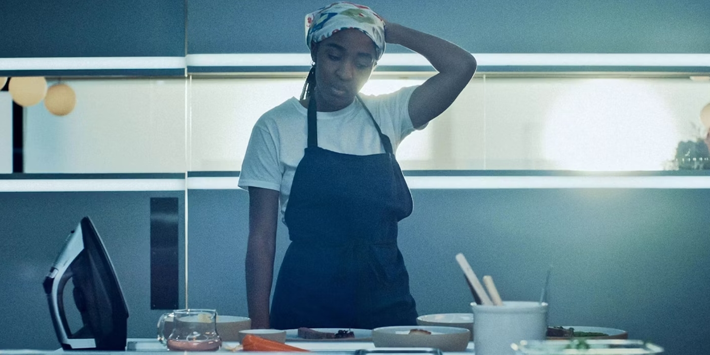 Ayo Edebiri's Sydney looking down at a table of ingredients in The Bear | Agents of Fandom