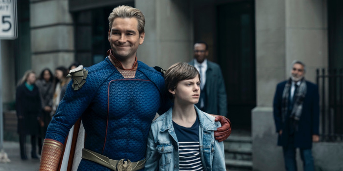 Homelander with his arm around his son Ryan standing in the street in The Boys Season 4 | Agents of Fandom