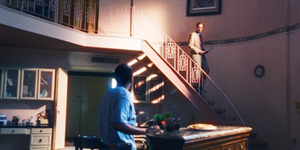 Robert Pattinson walking down the stairs looking at Tony Revolori in Primetime | Agents of Fandom